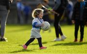 14 October 2018; Two year old St. Vincent's supporter Orlagh Feehan plays ball during half time in the Dublin County Senior Club Football Championship semi-final match between St. Jude's and St. Vincent's at Parnell Park, Dublin. Photo by Ray McManus/Sportsfile