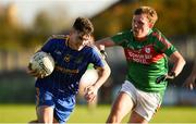 14 October 2018; Jamie Fahy of Clann na Gael in action against Ronan Stack of St.Brigid's during the Roscommon County Senior Club Football Championship Final match between Clann na Gael and St Brigid's at Dr Hyde Park, Roscommon. Photo by Barry Cregg/Sportsfile