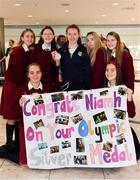 15 October 2018; Niamh Coyne of Team Ireland, from Tallaght, Dublin, with her classmates from Sancta Maria College in Ballyroan, Dublin, on the Team Ireland swimming team return from the Youth Olympic Games in Buenos Aires at Dublin Airport in Dublin. Photo by Brendan Moran/Sportsfile