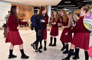 15 October 2018; Niamh Coyne of Team Ireland, from Tallaght, Dublin, who won a silver medal in the women's 100m breastsrtoke, is greeted by her classmates from Sancta Maria College in Ballyroan, Dublin, on the Team Ireland swimming team return from the Youth Olympic Games in Buenos Aires at Dublin Airport in Dublin. Photo by Brendan Moran/Sportsfile