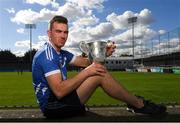 15 October 2018; Ballyboden St. Enda's hurler Simon Lambert with The New Ireland Assurance Company Perpetual Challenge Cup during a Dublin SHC / SFC Finals Media Launch at Parnell Park in Dublin. Photo by Piaras Ó Mídheach/Sportsfile