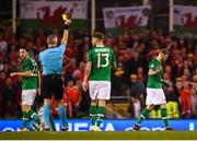 16 October 2018; James McClean of Republic of Ireland receives a yellow card from referee Björn Kuipers during the UEFA Nations League B group four match between Republic of Ireland and Wales at the Aviva Stadium in Dublin. Photo by Stephen McCarthy/Sportsfile
