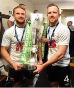 19 October 2018; Dane Massey, left, and Sean Hoare of Dundalk celebrate with the trophy after winning the SSE Aitricity League Premier Division, following the SSE Airtricity League Premier Division match between Dundalk and Sligo Rovers at Oriel Park in Dundalk, Louth. Photo by Seb Daly/Sportsfile