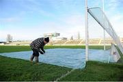 18 December 2011; O'Connor Park groundsman Jimmy Cronly removes the cover pegs as he prepares the pitch before the start of the game. AIB Leinster GAA Football Senior Club Championship Final, St Brigid's, Dublin v Garrycastle, Westmeath, O'Connor Park, Tullamore, Co. Offaly. Picture credit: Barry Cregg / SPORTSFILE