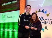 20 October 2018; Dublin and Raheny footballer Brian Fenton presents the 'Hero Award' to Katherine Williams of Melvin Gaels during the GAA National Healthy Club Conference at Croke Park Stadium, in Dublin. Photo by David Fitzgerald/Sportsfile