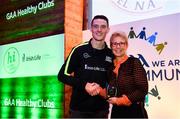 20 October 2018; Dublin and Raheny footballer Brian Fenton presents the 'Hero Award' to Joan McElwee of Thomastown GAA Club during the GAA National Healthy Club Conference at Croke Park Stadium, in Dublin. Photo by David Fitzgerald/Sportsfile