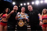 20 October 2018; Katie Taylor celebrates with trainer Ross Enamait, left, and manager Brian Peters following her WBA & IBF Female Lightweight World title bout against Cindy Serrano at TD Garden in Boston, Massachusetts, USA. Photo by Stephen McCarthy/Sportsfile