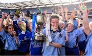 22 October 2018; Grace Murphy-Cruse of Scoil Mhuire, Sandymount, Co. Dublin, celebrates with the cup and her teammates during day 1 of the Allianz Cumann na mBunscol Finals at Croke Park in Dublin.  Photo by Sam Barnes/Sportsfile