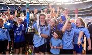 22 October 2018; Grace Murphy-Cruse of Scoil Mhuire, Sandymount, Co. Dublin, celebrates with the cup and her teammates during day 1 of the Allianz Cumann na mBunscol Finals at Croke Park in Dublin.  Photo by Sam Barnes/Sportsfile