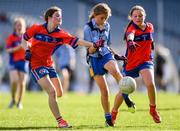 22 October 2018; Ella May Spain of Scoil Mhuire Sandymount, Co. Dublin, in action against Liv Foley, left, and Mairéad Hanratty of Belgrove Senior GNS, Clontarf, Co. Dublin, during day 1 of the Allianz Cumann na mBunscol Finals at Croke Park in Dublin.  Photo by Sam Barnes/Sportsfile