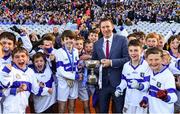 22 October 2018; Cathal Manning of Scoil Mhuire BNS team, Marino, Co. Dublin, is presented with the cup by Alan Black, Allianz, during day 1 of the Allianz Cumann na mBunscol Finals at Croke Park in Dublin.  Photo by Sam Barnes/Sportsfile