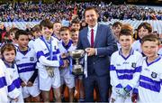 22 October 2018; Cathal Manning of Scoil Mhuire BNS team, Marino, Co. Dublin, is presented with the cup by Alan Black, Allianz, during day 1 of the Allianz Cumann na mBunscol Finals at Croke Park in Dublin.  Photo by Sam Barnes/Sportsfile