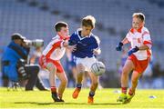 22 October 2018; Dara Condren O'Brien of St Kevins BNS, Kilnamanagh, in action against Cathal Ó hlcí, left, and Scott Ó Brádaigh of Gaelscoil Cholmcille, Lána na Cúlóige, during day 1 of the Allianz Cumann na mBunscol Finals at Croke Park in Dublin. Photo by Sam Barnes/Sportsfile