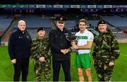 22 October 2018; Winning captain Gary White of The Irish Defence Forces is presented with the cup by, from left, Detective Sergeant Brian Willoughby, Major General Kieran Brennan, Assistant Commissioner of An Garda Síochána Fintan Fanning, and Chief of Staff Mark Mellet after the John Morley Memorial Cup match between The Irish Defence Forces and An Garda Síochána at Croke Park in Dublin.  Photo by Piaras Ó Mídheach/Sportsfile