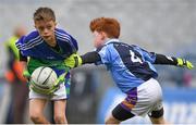 23 October 2018; Rocco Byrne from St. Oliver Plunkett NS, Malahide, Co Dublin, in action against Hugh McDonnell from Scoil San Treasa, Mount Merrion, Co Dublin, during day 2 of the Allianz Cumann na mBunscol Finals at Croke Park in Dublin. Photo by Harry Murphy/Sportsfile