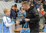 23 October 2018; Robbie Murray from Scoil San Treasa, Mount Merrion, Co Dublin, is presented with his runners-up medal by Westlife member Nicky Byrne during day 2 of the Allianz Cumann na mBunscol Finals at Croke Park in Dublin. Photo by Harry Murphy/Sportsfile