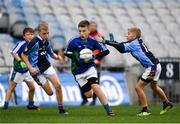 23 October 2018; Conor McGahan from St. Oliver Plunkett NS, Malahide, Co. Dublin in action against Tom Curtin, left, and Max McBreen from Scoil San Treasa, Mount Merrion, Co. Dublin during day 2 of the Allianz Cumann na mBunscol Finals at Croke Park in Dublin. Photo by Harry Murphy/Sportsfile