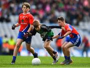 23 October 2018; Senan Bolger from St. Mary's BNS, Lucan, Co. Dublin in action against Harry Dignan, left, and Oscar Finnegan from Belgrove Senior BNS, Clontarf, Co. Dublin during day 2 of the Allianz Cumann na mBunscol Finals at Croke Park in Dublin. Photo by Harry Murphy/Sportsfile