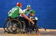 27 October 2018; Garry O'Halloran of Munster in action against Lorcan Madden, left, and Paul Cullen of Leinster during the M.Donnelly GAA Wheelchair Hurling All-Ireland Finals match between Munster and Leinster at the Sport Ireland National Indoor Arena in Abbotstown, Dublin. Photo by Barry Cregg/Sportsfile