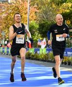 28 October 2018; Sean Doyle, from Naas, Co. Kildare, left, and Paul Cullen, from Donegal, during the 2018 SSE Airtricity Dublin Marathon. 20,000 runners took to the Fitzwilliam Square start line to participate in the 39th running of the SSE Airtricity Dublin Marathon, making it the fifth largest marathon in Europe. Photo by Ramsey Cardy/Sportsfile