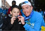 28 October 2018; Gary Farrell with his son Josh after completing the 2018 SSE Airtricity Dublin Marathon. 20,000 runners took to the Fitzwilliam Square start line to participate in the 39th running of the SSE Airtricity Dublin Marathon, making it the fifth largest marathon in Europe. Photo by Ramsey Cardy/Sportsfile