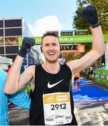 28 October 2018; Sean Doyle, from Naas, Co. Kildare, celebrates crossing the finish line during the 2018 SSE Airtricity Dublin Marathon. 20,000 runners took to the Fitzwilliam Square start line to participate in the 39th running of the SSE Airtricity Dublin Marathon, making it the fifth largest marathon in Europe. Photo by Ramsey Cardy/Sportsfile