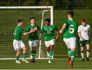 29 October 2018; Glory Nzinga of Republic of Ireland U15, 13, celebrates with team-mates after scoring his side's second goal during the Republic of Ireland U15 and Republic of Ireland U16 match at FAI National Training Centre in Abbotstown, Dublin. Photo by Seb Daly/Sportsfile