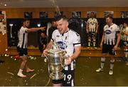 4 November 2018; Ronan Murray of Dundalk celebrates with the cup in the dressing room after the Irish Daily Mail FAI Cup Final match between Cork City and Dundalk at the Aviva Stadium in Dublin. Photo by Eóin Noonan/Sportsfile