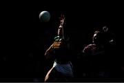 This atmospheric shot from the All-Ireland minor football final plays with light and shade in the manner of the great painters. Two figures emerge from the canvas, with Kerry corner forward Michael Lenihan racing out to the ball a step ahead of Ethan Walsh of Galway    This image may be reproduced free of charge when used in conjunction with a review of the book &quot;A Season of Sundays 2018&quot;. All other usage © SPORTSFILE