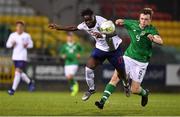 8 November 2018; Conor Carty of Republic of Ireland in action against Dynel Simeu of England during the U17 International Friendly match between Republic of Ireland and England at Tallaght Stadium in Tallaght, Dublin. Photo by Brendan Moran/Sportsfile