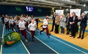 14 November 2018; Author Peter Byrne, with, from left, CEO Athletics Ireland Hamish Adams, CEO of Sport Ireland John Treacy, President of Athletics Ireland Georgina Drumm, Irish long distance runner Catherina McKiernan, former Irish Olympian Eamonn Coghlan, and Dr Ronnie Delany, cheer on students from St Brigid's National School, Castleknock, as they complete their Daily Mile during the launch of ‘Winning for Ireland - How Irish Athletes Conquered The World’, at the National Indoor Arena in Abbotstown, Dublin. Photo by Seb Daly/Sportsfile