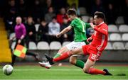 14 November 2018; Oliver O'Neill of Republic of Ireland scores his side's foirth goal despite the best efforts  of Jay Williams of Wales during the U16 Victory Shield match between Republic of Ireland and Wales at Mounthawk Park in Tralee, Kerry. Photo by Brendan Moran/Sportsfile