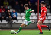 14 November 2018; Oliver O'Neill of Republic of Ireland scores his side's fourth goal despite the attention of Jay Williams of Wales during the U16 Victory Shield match between Republic of Ireland and Wales at Mounthawk Park in Tralee, Kerry. Photo by Brendan Moran/Sportsfile