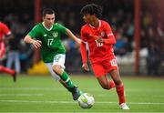 14 November 2018; Jadan Raymond of Wales in action against Jamie Doyle of Republic of Ireland  during the U16 Victory Shield match between Republic of Ireland and Wales at Mounthawk Park in Tralee, Kerry. Photo by Brendan Moran/Sportsfile