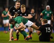 17 November 2018; Jacob Stockdale of Ireland is tackled by Jack Goodhue, right, and Damian McKenzie of New Zealand during the Guinness Series International match between Ireland and New Zealand at the Aviva Stadium in Dublin. Photo by David Fitzgerald/Sportsfile