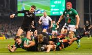 17 November 2018; Jacob Stockdale of Ireland scores his side's first try despite the tackle of Damian McKenzie and Aaron Smith of New Zealand during the Guinness Series International match between Ireland and New Zealand at the Aviva Stadium in Dublin. Photo by Ramsey Cardy/Sportsfile