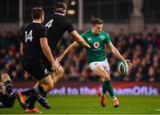 17 November 2018; Jacob Stockdale of Ireland kicks through the New Zealand defence on his way to scoring his side's first try during the Guinness Series International match between Ireland and New Zealand at the Aviva Stadium in Dublin. Photo by Ramsey Cardy/Sportsfile
