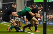 17 November 2018; Ben Smith of New Zealand is forced into touch by Jonathan Sexton and Jacob Stockdale of Ireland during the Guinness Series International match between Ireland and New Zealand at the Aviva Stadium in Dublin. Photo by Ramsey Cardy/Sportsfile