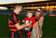 18 November 2018; Ferdia O'Sullivan, aged 2, refuses to give the cup back to his father, Ballygunner joint captain Shane O'Sullivan, as he celebrates with his partner Ciara after the AIB Munster GAA Hurling Senior Club Championship Final between Na Piarsaigh and Ballygunner at Semple Stadium in Thurles, Co. Tipperary. Photo by Diarmuid Greene/Sportsfile