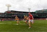 18 November 2018; Damien Cahalane of Cork gets away from Shane Golden, centre, and Aron Shanagher of Clare  during the Aer Lingus Fenway Hurling Classic 2018 semi-final match between Clare and Cork at Fenway Park in Boston, MA, USA. Photo by Piaras Ó Mídheach/Sportsfile