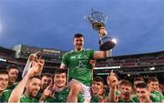 18 November 2018; Limerick captain Declan Hannon is held aloft by his team mates as they celebrate with the Players Champions Cup after winning the Aer Lingus Fenway Hurling Classic 2018 Final match between Cork and Limerick at Fenway Park in Boston, MA, USA. Photo by Piaras Ó Mídheach/Sportsfile