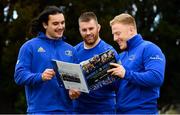 19 November 2018; Double Delight, a picture diary looking back at Leinster Rugby’s historic double winning season, was launched today at Leinster Rugby Headquarters in Dublin.The 144-page book retraces each game of the season through the Sportsfile team’s lenses from the first round PRO14 away trip in Rodney Parade to the Aviva Stadium. Leinster Rugby also confirmed that thanks to the support of title partner Bank of Ireland and premium partners Laya Healthcare and Life Style Sports, all profits from the sale of Double Delight will be donated to MS Ireland and the Down Syndrome Centre, Leinster’s two charity partners. Pictured at the launch are Leinster players, from left, James Lowe, Sean O'Brien and James Tracy. Photo by Ramsey Cardy/Sportsfile