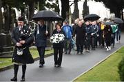 21 November 2018; Piper Pat Nolan in front of Uachtarán Chumann Lúthchleas Gael John Horan, left, and GAA Communications Officer Siobhan Brady lead the procession to the unveiling of a memorial headstone to Bloody Sunday victim John William Scott who was shot and killed aged 14 at Croke Park at Glasnevin Cemetery in Dublin. Photo by David Fitzgerald/Sportsfile