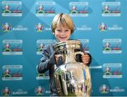 24 November 2018; Josh Clarke, age 6, from Rathfarnham, Dublin, with the Henri Delaunay Trophy at the National Football Exhibition at Dundrum Shopping Centre in Dundrum, Dublin. Photo by Seb Daly/Sportsfile