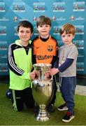 24 November 2018; Brothers, from left, Sean, age 10, Conor, age 5, and Rory Griffin, age 3, from Greystones, Co. Wicklow, with the Henri Delaunay Trophy at the National Football Exhibition at Dundrum Shopping Centre in Dundrum, Dublin. Photo by Seb Daly/Sportsfile