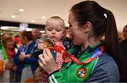 25 November 2018; World Champion Kellie Harrington with cousin Erin Duffy, age 10 months, and her gold medal on Team Ireland's return from AIBA Women's World Boxing Championship at Dublin Airport, Dublin. Photo by Brendan Moran/Sportsfile