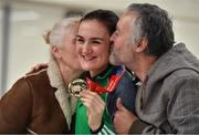 25 November 2018; World Champion Kellie Harrington with her parents Yvonne and Christy and her gold medal on Team Ireland's return from AIBA Women's World Boxing Championship at Dublin Airport, Dublin. Photo by Brendan Moran/Sportsfile