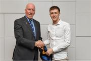 26 November 2018; Brian Mullins, Director of Sport, UCD, presents footballer Brian Byrne of Naas and Kildare with a UCD scarf during the UCD GAA Sports Scholarship Presentation 2018/2019 at UCD in Dublin. Photo by Piaras Ó Mídheach/Sportsfile