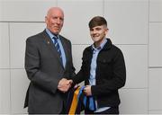 26 November 2018; Brian Mullins, Director of Sport, UCD, presents hurler Rian Considine of Cratloe and Clare with a UCD scarf during the UCD GAA Sports Scholarship Presentation 2018/2019 at UCD in Dublin. Photo by Piaras Ó Mídheach/Sportsfile