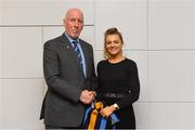 26 November 2018; Brian Mullins, Director of Sport, UCD, presents camogie player Catherine Costelloe of Faugh's and Dublin with a UCD scarf during the UCD GAA Sports Scholarship Presentation 2018/2019 at UCD in Dublin. Photo by Piaras Ó Mídheach/Sportsfile